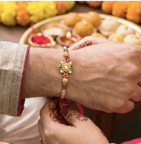 Premium Floral Pearl Bhabhi Lumba Rakhi with Golden Latkan – Elegant Designer Rakhi for Raksha Bandhan