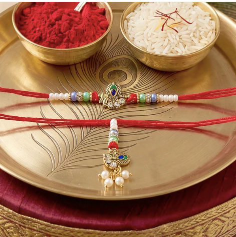 Premium Pearl Cluster Bhabhi Lumba Rakhi – Elegant Peacock Charm Designer Rakhi for Raksha Bandhan