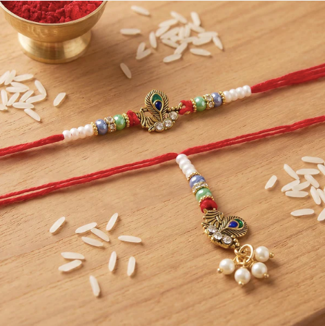 Premium Pearl Cluster Bhabhi Lumba Rakhi – Elegant Peacock Charm Designer Rakhi for Raksha Bandhan