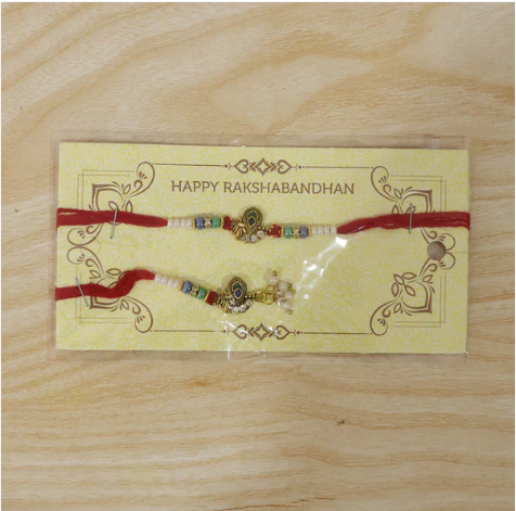 Premium Pearl Cluster Bhabhi Lumba Rakhi – Elegant Peacock Charm Designer Rakhi for Raksha Bandhan