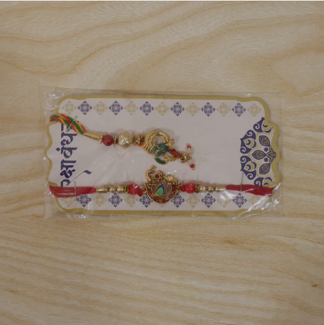 Peacock Latkan Bhabhi Rakhi – Elegant Pearl Beaded Rakhi for Sister-in-Law