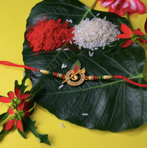 Premium Krishna Flute Rakhi – Stone Studded Peacock Feather Designer Rakhi for Brother | Divine Raksha Bandhan Special